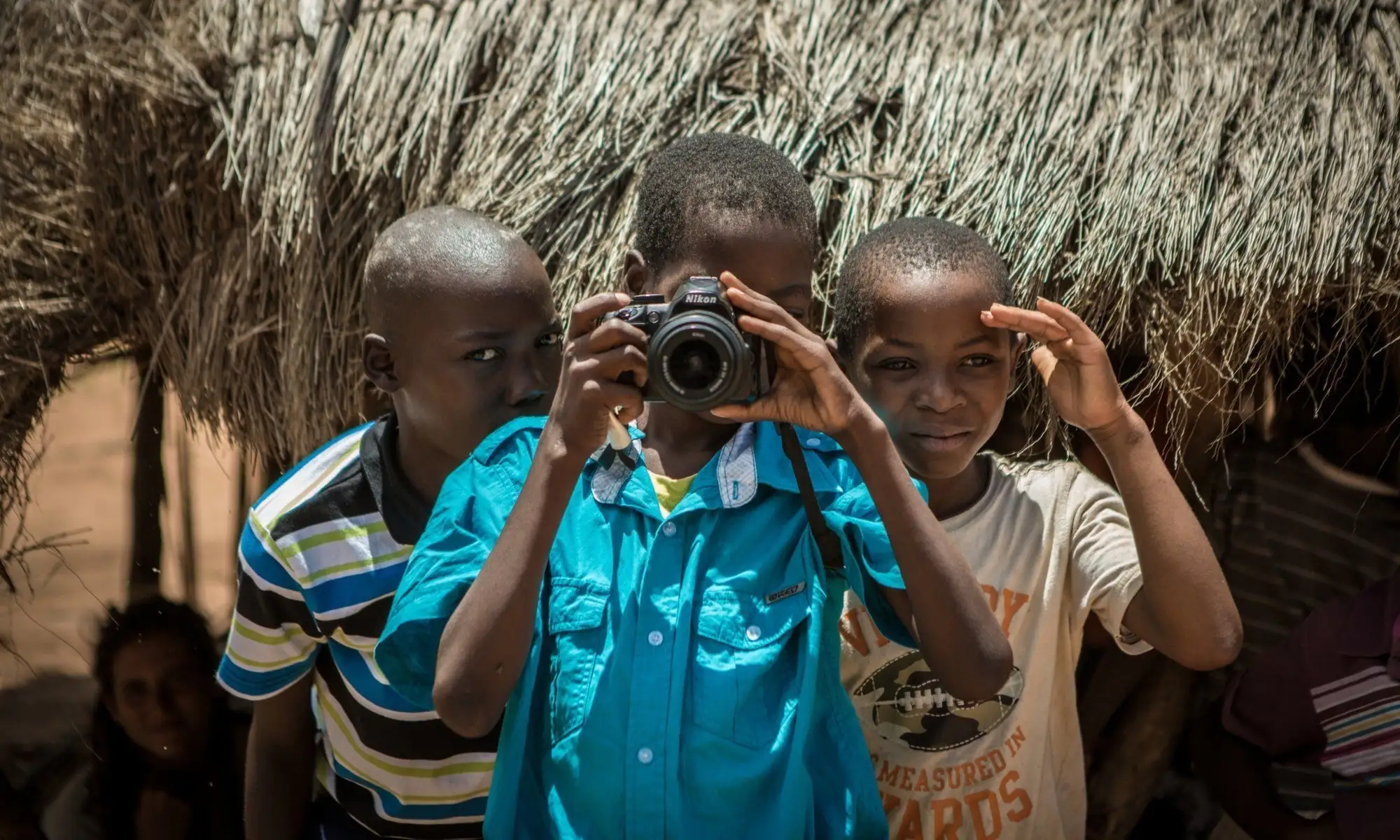 Three kids with a camera